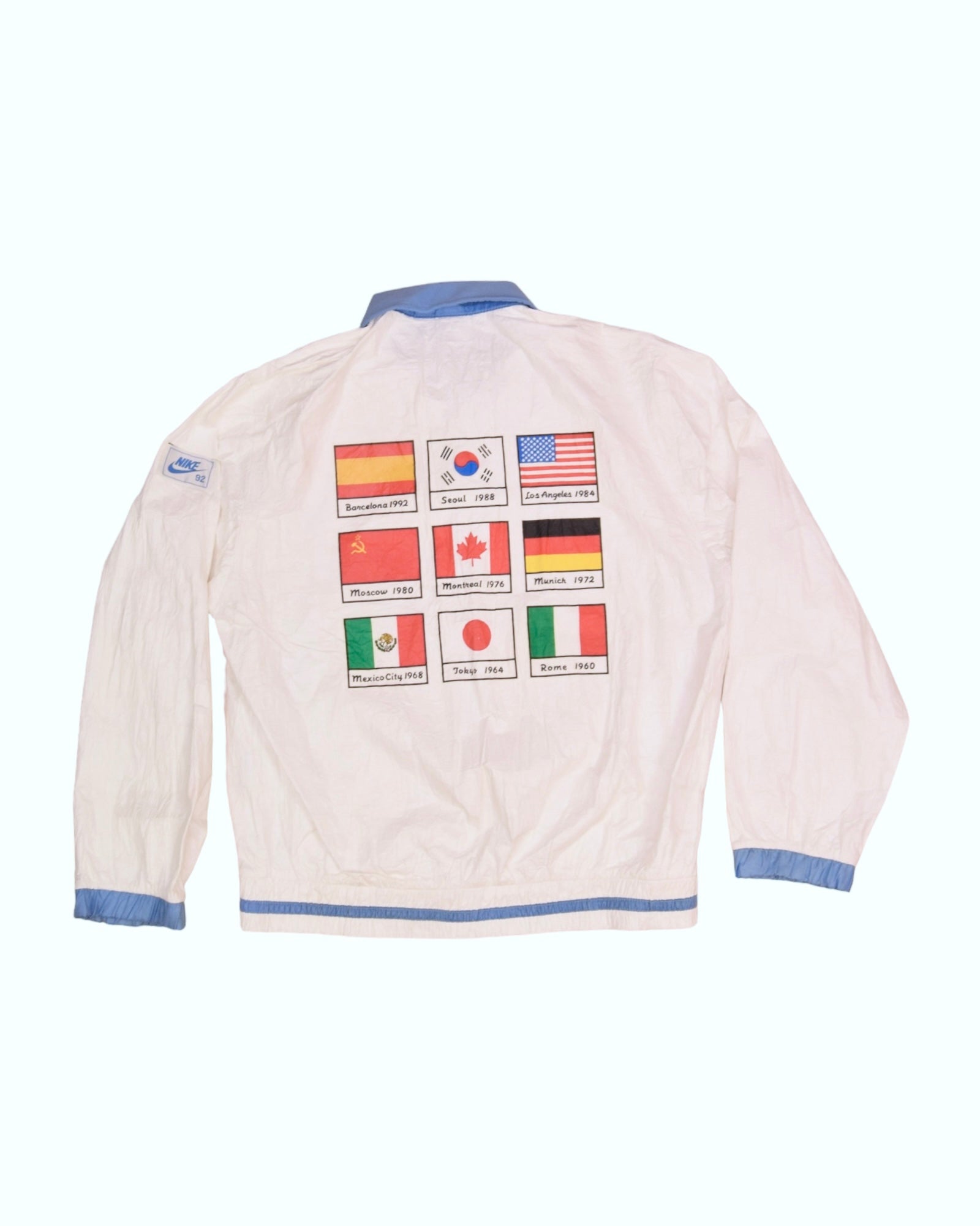 Vintage Nike 1992 Olympics Jacket Size L Made in Korea White Barcelona 1992 Seoul 1988 Los Angeles 1984 Moscow 1980 Montreal 1976 Munich 1972 Mexico City 1968 Tokyo 1964 Rome 1960